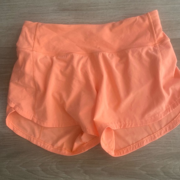 Lululemon orange shorts, size 4-6. Never worn. - Picture 2 of 4